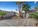 A charming backyard with mature palm trees and decorative brickwork at 3791 El Camino Rd, Las Vegas, NV 89103