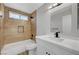 Bathroom with modern vanity, shower-tub combo with decorative tile at 3791 El Camino Rd, Las Vegas, NV 89103