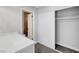 Bedroom closet with white sliding doors and an ensuite bathroom, plus neutral walls and carpet at 3791 El Camino Rd, Las Vegas, NV 89103