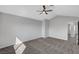 Neutral bedroom with carpet, closet, an ensuite bathroom, and a ceiling fan for air circulation at 3791 El Camino Rd, Las Vegas, NV 89103
