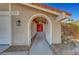 Arched walkway to a red front door at 3791 El Camino Rd, Las Vegas, NV 89103