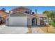 Charming home with a two-car garage and unique gated front entrance at 3791 El Camino Rd, Las Vegas, NV 89103