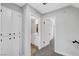 Hallway with closet area leading to rooms and a bathroom, with carpet flooring at 3791 El Camino Rd, Las Vegas, NV 89103