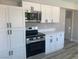 New stainless steel appliances, countertops, and hardware accent the ample storage in this remodeled kitchen at 3791 El Camino Rd, Las Vegas, NV 89103