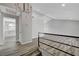 Open-concept living area with a chandelier and laminate floors at 3791 El Camino Rd, Las Vegas, NV 89103