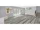 Bright living room with views of the pool through sliding glass doors at 3791 El Camino Rd, Las Vegas, NV 89103