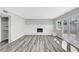 Bright living room with a charming fireplace and access to outdoor patio at 3791 El Camino Rd, Las Vegas, NV 89103