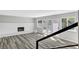 Spacious living room with white brick fireplace and sliding doors to backyard at 3791 El Camino Rd, Las Vegas, NV 89103