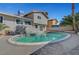 A spacious swimming pool in the backyard with a grey stucco exterior at 3791 El Camino Rd, Las Vegas, NV 89103