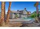 Backyard pool with patio and desert landscaping, creating a tranquil setting for outdoor relaxation and enjoyment at 3791 El Camino Rd, Las Vegas, NV 89103