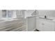 Bright wet bar and breakfast nook area featuring light gray flooring and new cabinets at 3791 El Camino Rd, Las Vegas, NV 89103