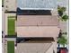 Aerial shot showing the roof, lawn, and side yard with artificial turf in a neatly planned community at 3808 Seyfert Ave, North Las Vegas, NV 89084