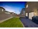 Inviting backyard featuring a lush lawn, brick patio, and modern home at 3808 Seyfert Ave, North Las Vegas, NV 89084