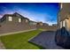 Inviting backyard featuring a lush lawn, brick patio, and a modern BBQ at 3808 Seyfert Ave, North Las Vegas, NV 89084