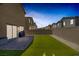Inviting backyard featuring a lush lawn, brick patio, and modern home at 3808 Seyfert Ave, North Las Vegas, NV 89084