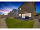 Inviting backyard featuring a lush lawn, brick patio, and modern home at 3808 Seyfert Ave, North Las Vegas, NV 89084