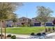 Picturesque community park, featuring lush grass, mature trees, and neighborhood homes in the background at 3808 Seyfert Ave, North Las Vegas, NV 89084