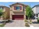 Charming two-story home featuring a two-car garage, desert landscaping, and neutral stucco at 3808 Seyfert Ave, North Las Vegas, NV 89084