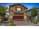 Charming two-story home featuring a two-car garage, desert landscaping, and neutral stucco at 3808 Seyfert Ave, North Las Vegas, NV 89084