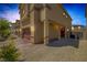 Side view of home showing garage and entrance with colorful brick driveway and low maintenance yard at 3808 Seyfert Ave, North Las Vegas, NV 89084