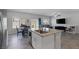Open concept kitchen and living area with a large kitchen island and stainless steel appliances at 3808 Seyfert Ave, North Las Vegas, NV 89084