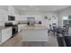 Spacious kitchen with stainless steel appliances, granite countertops, tile flooring and dining area at 3808 Seyfert Ave, North Las Vegas, NV 89084