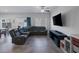 Cozy living room with a large sectional sofa, entertainment center, and backyard access at 3808 Seyfert Ave, North Las Vegas, NV 89084