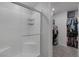 Bright shower stall with glass enclosure, white subway tile, and a view to the walk-in closet at 3808 Seyfert Ave, North Las Vegas, NV 89084
