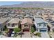 Inviting street view of modern homes showcasing landscaped front yards, driveways, and attached garages at 3808 Seyfert Ave, North Las Vegas, NV 89084