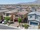 Street view of modern two-story homes featuring low-maintenance landscaping and visible garages at 3808 Seyfert Ave, North Las Vegas, NV 89084