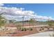 Well-maintained community tennis courts surrounded by desert landscaping and residential homes, under a cloudy sky at 3808 Seyfert Ave, North Las Vegas, NV 89084