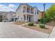 Two-story home featuring a balcony, neutral-toned exterior, manicured landscaping, and a welcoming entrance at 4517 Lime Straight Dr, Las Vegas, NV 89115