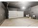 Spacious garage with an electric door opener and dark grey paint at 4517 Lime Straight Dr, Las Vegas, NV 89115
