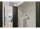 Convenient laundry room with washer, dryer and shelving near the stairway at 4517 Lime Straight Dr, Las Vegas, NV 89115