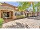 Stamped concrete patio with awnings providing shade to windows and glass doors of this bright and airy home at 465 Indigo Springs St, Henderson, NV 89014