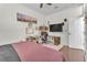 Spacious bedroom with a ceiling fan, hardwood floors, and closet space at 465 Indigo Springs St, Henderson, NV 89014