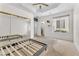 Large bedroom with ceiling fan, mirrored closet doors, and ample natural light at 465 Indigo Springs St, Henderson, NV 89014
