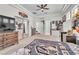 Bright bedroom with a ceiling fan, large windows, and a mirrored closet at 465 Indigo Springs St, Henderson, NV 89014