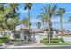 Beautiful single-story home with palm trees and manicured landscaping, enhancing the curb appeal at 465 Indigo Springs St, Henderson, NV 89014