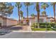 Charming single story home with well manicured lawn and lush palm trees in a desirable neighborhood at 465 Indigo Springs St, Henderson, NV 89014