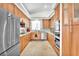 Bright kitchen featuring wood cabinets, stainless steel appliances, and a mosaic backsplash at 465 Indigo Springs St, Henderson, NV 89014
