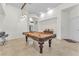 Spacious recreation room with a pool table, pendant lighting, and comfortable seating at 465 Indigo Springs St, Henderson, NV 89014