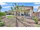 Charming backyard featuring a covered patio, desert landscaping, and a well-maintained lawn at 5226 Lignum Ave # 1, Pahrump, NV 89061