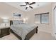 Bedroom with neutral paint, grey carpet, and a queen size bed at 5226 Lignum Ave # 1, Pahrump, NV 89061