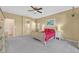 A bright bedroom features a large bed, carpet floors, neutral paint, and an ensuite bathroom at 5226 Lignum Ave # 1, Pahrump, NV 89061