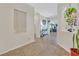Light-filled entryway with tile flooring, decorative wall art, and bright neutral paint at 5226 Lignum Ave # 1, Pahrump, NV 89061
