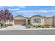 Inviting single-story home with a two-car garage, desert landscaping, and neutral color palette at 5226 Lignum Ave # 1, Pahrump, NV 89061