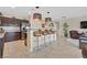 Stylish kitchen featuring a breakfast bar with pendant lighting and stainless-steel appliances at 5226 Lignum Ave # 1, Pahrump, NV 89061