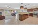 Open-concept kitchen with a breakfast bar, stainless steel appliances, and seamless flow at 5226 Lignum Ave # 1, Pahrump, NV 89061