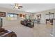 Spacious living room with plush seating, ceiling fan, and access to the backyard at 5226 Lignum Ave # 1, Pahrump, NV 89061